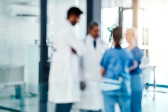 A blurred image of doctors and nurses