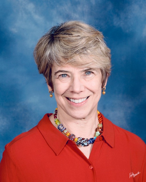 Headshot of Susan Friedberg Kalson wearing red 