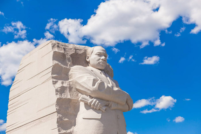MLK monument in Washington DC against a cloudy blue sky