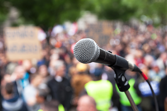 Microphone and crowd behind it