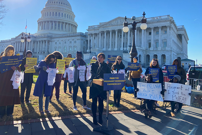 a group of people at the Pregnant Workers Fairness Act Rally on December 1, 2022 holding signs that say Pass the Pregnant Workers Fairness Act