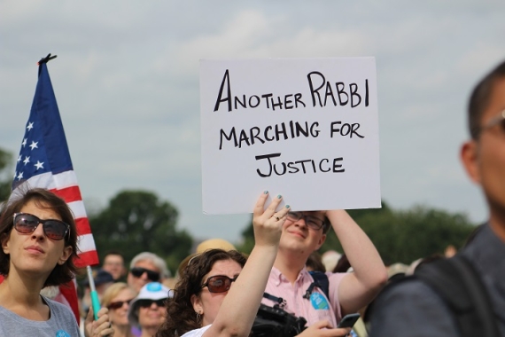 march photo holding sign stating: "Another rabbi marching for racial justice"