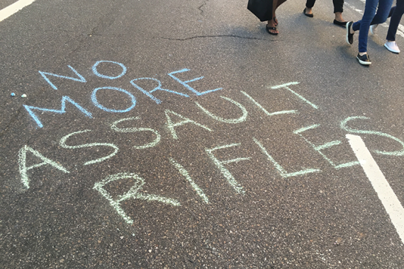 no more assault rifles written in chalk on street