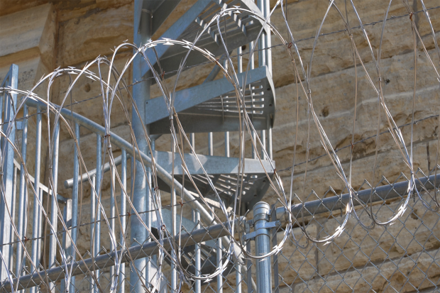 Photo of a Maximum Security Prison In The Midwest with barbed wire