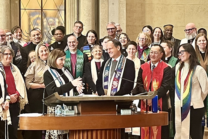 Rabbi Jonah Pesner speaking at a gathering in Minneapolis, bringing solidarity and strength to the community