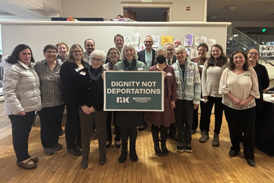 Photo of a group of twenty-five RAC-MA, Jewish Alliance for Law and Social Action (JALSA), and Unitarian Universalist (UU) Mass Action volunteers and congregational leaders who traveled to the State House for our Dignity Not Deportations Advocacy Day