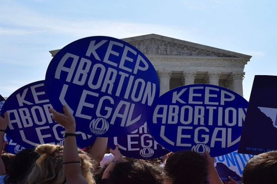 signs held in front of Supreme Court saying "Keep abortion legal"