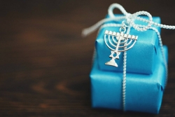 Stack gifts in blue wrapping paper with silver bows and a Star of David charm
