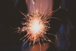 Closeup of a hand holding a sparkler