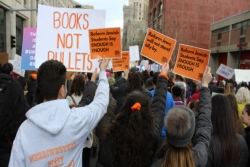 Reform Jewish teens seen from behind at gun violence prevention march
