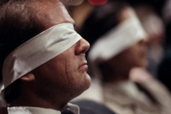 Man wearing a blindfold - side view
