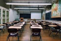 chairs in classroom with projector screen