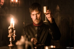 In a still from Game of Thrones Ser Jaime Lannister played by actor Nikolaj Coster Waldau holds up a silver goblet as in a toast