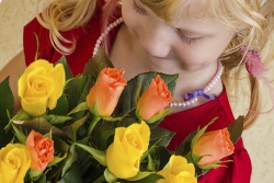 young girl giving bouquet of roses