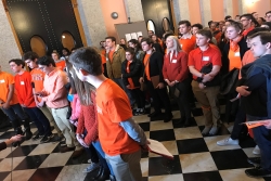 Ohio students, wearing orange for gun violence, speak to press and onlookers at the Columbus Statehouse