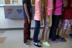 Children standing in line at an ICE facility