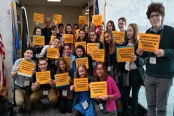 Group of teens holding gun violence prevention signs
