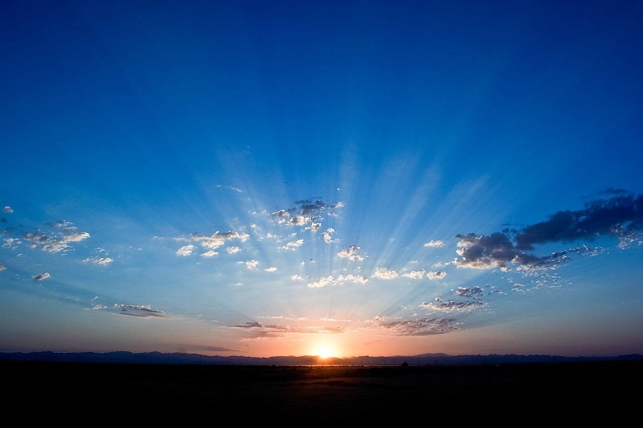 sunrise, blue sky, clouds, mountains in distance