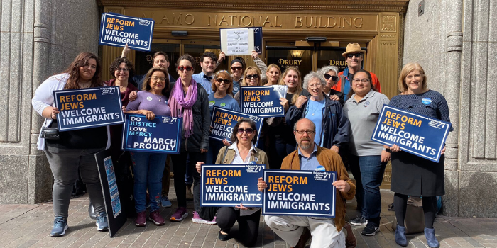 Large group of people in front of a building